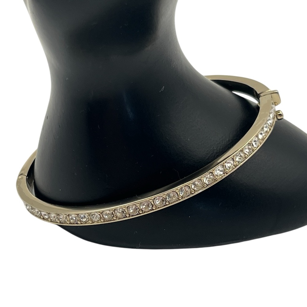 Givenchy gold tone rhinestone oval bangle tennis bracelet hinged